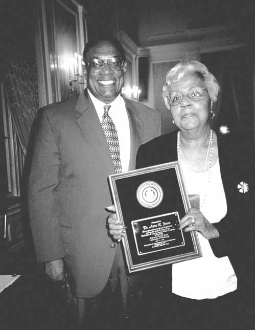 David Epperson next to Anne R. Jones holding an award